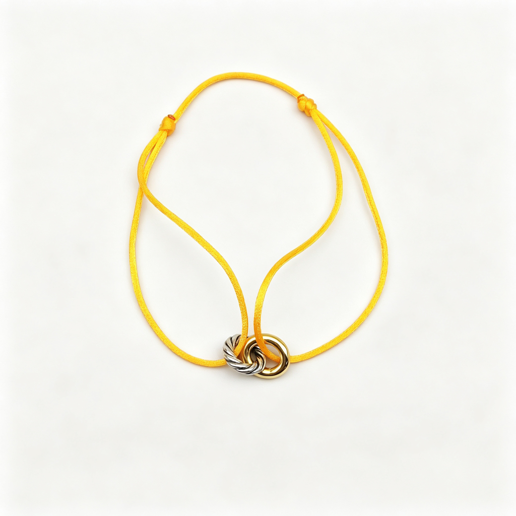 David Yurman Classic Cable Bracelet—gold, with a yellow cord.